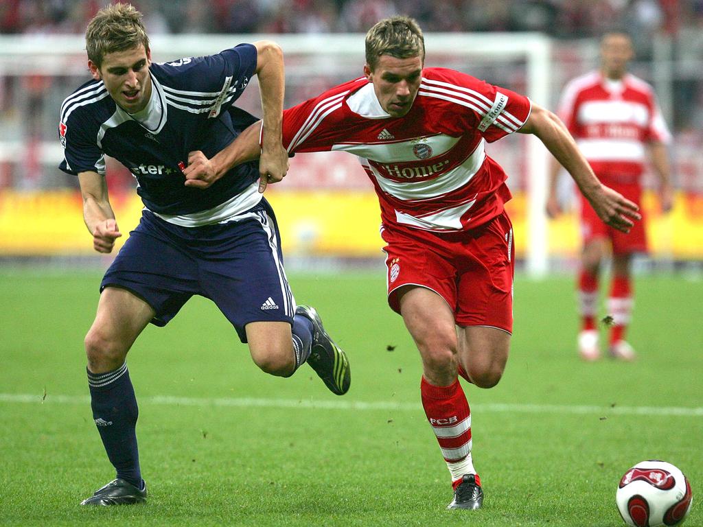 Spiranovic (L) competes for the ball with Bayern Munich’s Lukas Podolski in the Budesliga in 2007. Picture: Johannes Simon/Bongarts/Getty Images