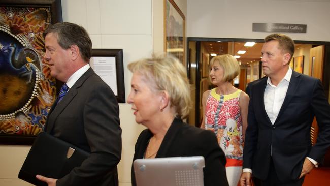 Tim Nicholls MP walking with supporters towards the Partyroom leadership spill, Parliament House Annexe, Brisbane. Photo: Liam Kidston