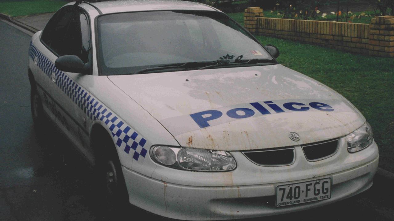 The police car covered in Daryl's blood.