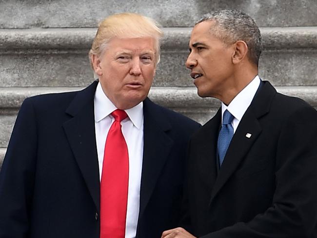 President Donald Trump and former President Barack Obama at Mr Trump’s inauguration in 2017. Picture: AFP