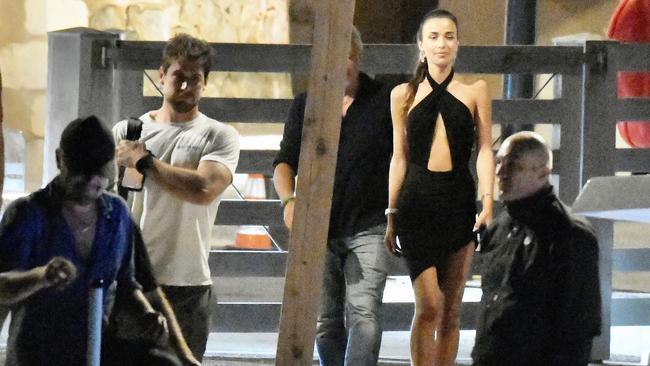 The 22-year-old wore a short black dress with cutout details for the night out. Picture: Spread Pictures / Mega Agency.