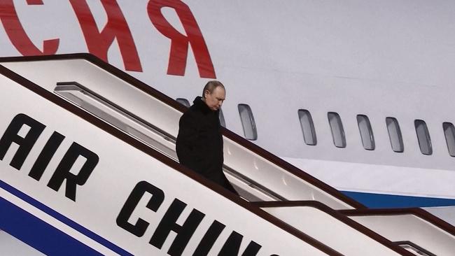 Russia's President Vladimir Putin disembarking upon his arrival in Beijing on February 4. Picture: AFP/China OUT