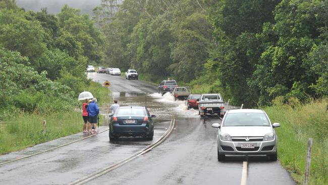 Flood chaos on Nambour-Mapleton Road – water over the road west of Kureelpa in January 2011. Photo: Brett Wortman / Sunshine Coast Daily