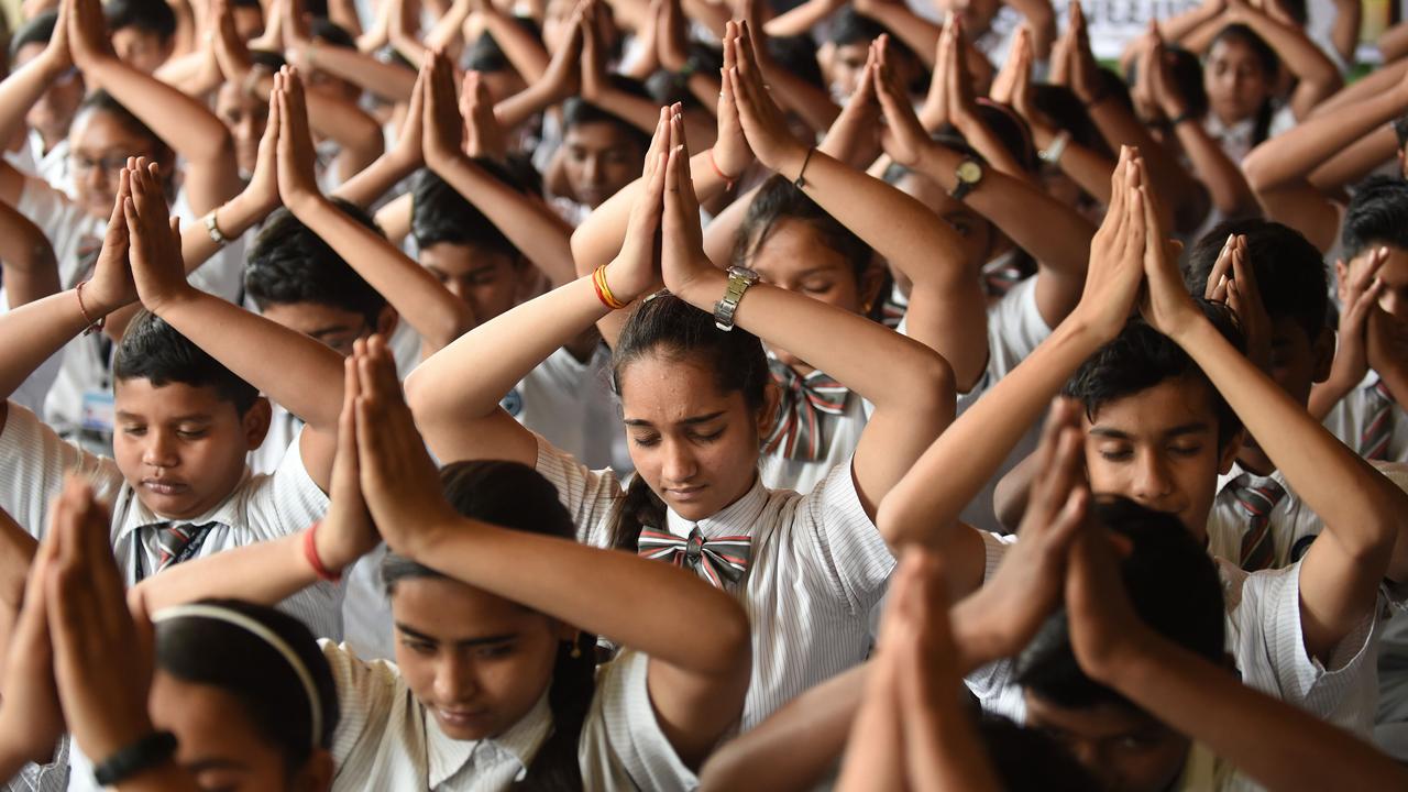 Indian students offer prayers during a function to pay tribute to paramilitary soldiers killed in Thursday’s explosion. Picture: Sam Panthaky/AFP