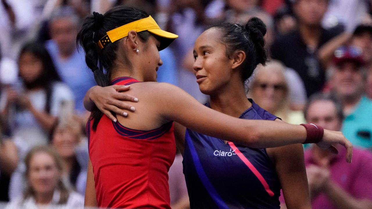 Britain's Emma Raducanu hugs Canada's Leylah Fernandez after winning the 2021 US Open Tennis. Photo by TIMOTHY A. CLARY / AFP.