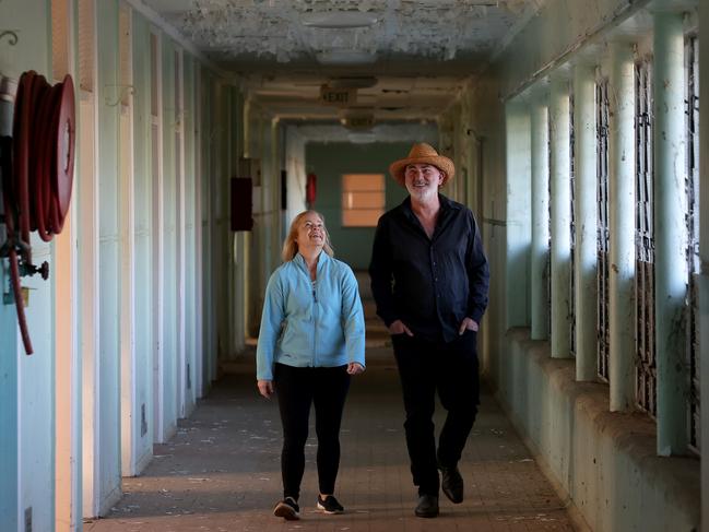 Les Bone and partner Vanessa Stanley-Johns in an unrenovated section of the psychiatric hospital. Picture: Toby Zerna