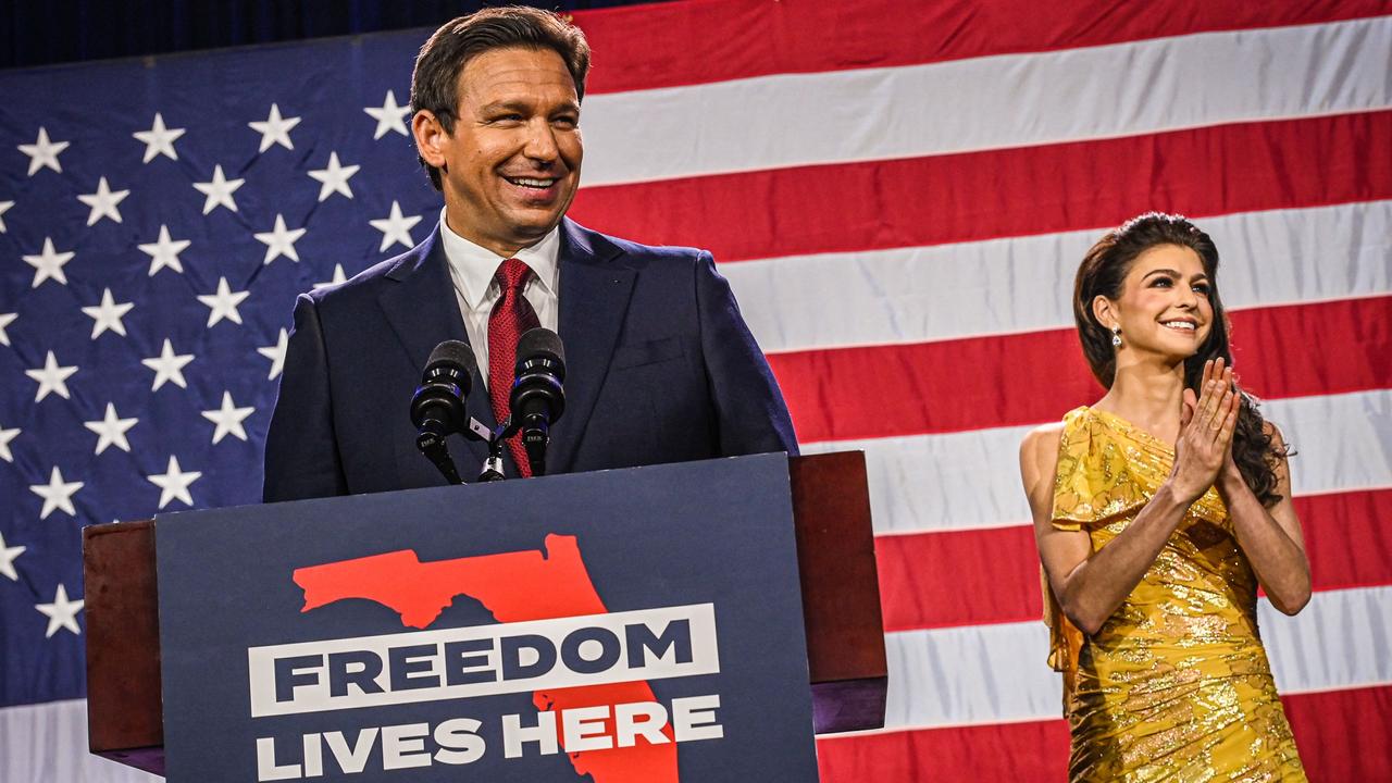 Republican gubernatorial candidate for Florida Ron DeSantis with his wife Casey DeSantis speaks to supporters during an election night watch party at the Convention Center in Tampa, Florida, on November 8, 2022. (Photo by Giorgio VIERA / AFP)