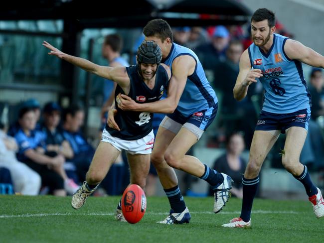 South Adelaide's Caleb Daniel tries for the ball. Photo: Sam Wundke.