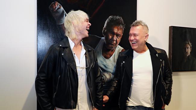 Artist Jamie Preisz with Jimmy Barnes, and his portrait of him. Picture: David Swift.