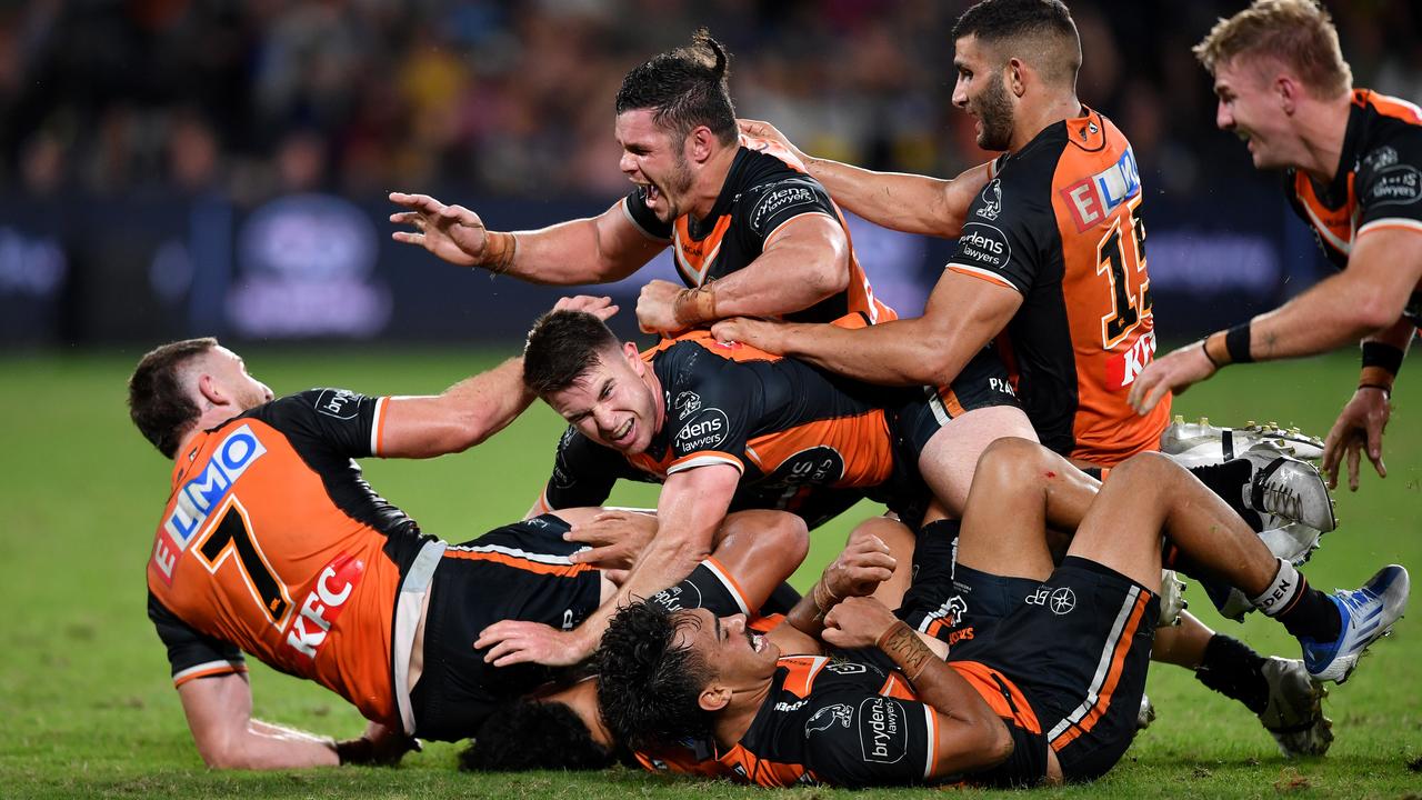 Jackson Hastings (left) was swamped by teammates after kicking the match-winning field goal against Parramatta. Picture: NRL Images