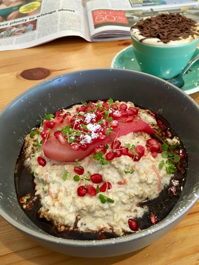 Greenslopes Bircher with pomegranate, poached pear and cacao.