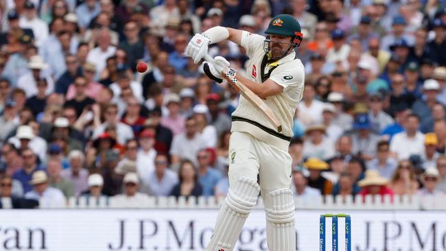 Australia's Travis Head is unable to control a bouncer from England's Stuart Broad. Picture: AFP