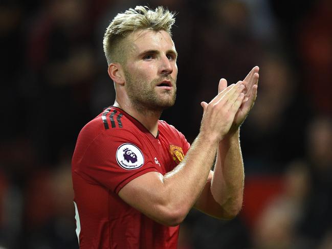 (FILES) In this file photo taken on August 10, 2018 Manchester United's English defender Luke Shaw gestures after the English Premier League football match between Manchester United and Leicester City at Old Trafford in Manchester, north west England. - England left-back Luke Shaw has ended speculation over his future by signing a new five-year deal with Manchester United, the club announced on October 18, 2018. (Photo by Oli SCARFF / AFP) / RESTRICTED TO EDITORIAL USE. No use with unauthorized audio, video, data, fixture lists, club/league logos or 'live' services. Online in-match use limited to 120 images. An additional 40 images may be used in extra time. No video emulation. Social media in-match use limited to 120 images. An additional 40 images may be used in extra time. No use in betting publications, games or single club/league/player publications /