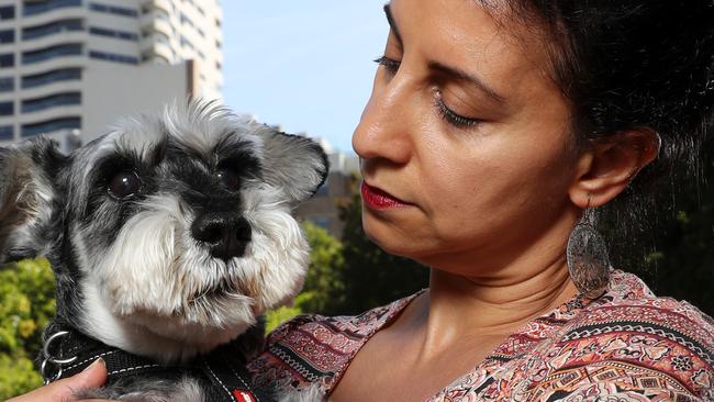 Jo Cooper has won a five year legal wrangle to be allowed to keep the dog Angus legally in her apartment. Pictured outside of The Horizon in Darlinghurst after the court has awarded costs against the owners corporation of the Harry Seidler designed Horizon building for being unjust and oppressive. But the Owners Corporation are appealing the court decision and it goes back to court in three weeks. Picture: Jonathan Ng