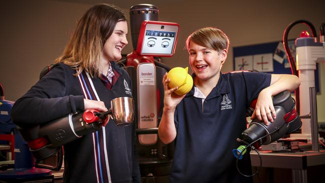 Heathfield High school students Ava and Mostyn, both 14, with “Baxter the Robot” in the lab. Picture: AAP / Mike Burton