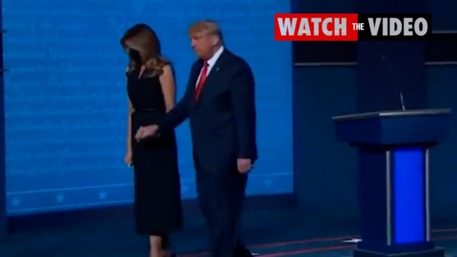 Awkward moment Melania pulls away from Trump