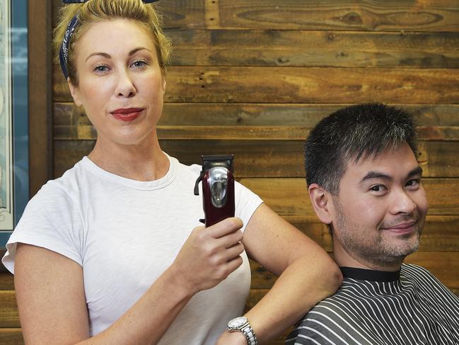 Joy Arnott owner of Star Barber has had a woman lodge an anti-discrimination complaint against her because she only cuts men's hair. Pictured with Carlos Sylianteng Picture: Keri Megelus