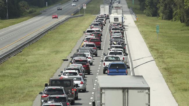 Traffic crawls north as Florida residents abandon their homes ahead of the storm.