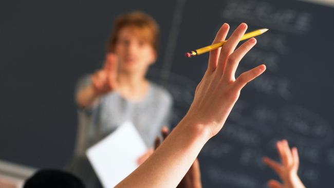 Teacher pointing to raised hands in classroom, Classroom, teaching generic, education generic, Teacher, Learning, Hand Raised, Education, Adult, School Building, Pointing, Standing, Image, Women, Adults Only, Colour Image, Horizontal, Human Arm, Human Body Part, Human Limb, Incidental People, Indoors, Limb, One Person, Only Women, People, Photography, thinkstock, generic, istock