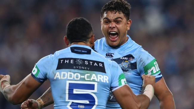 Latrell Mitchell and Josh Addo-Carr celebrate their State of Origin series win. (Photo by Cameron Spencer/Getty Images)