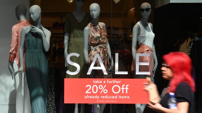 A pedestrian walks past a store in Pitt Street Mall in Sydney. Picture: AAP