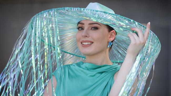 Kristen Febey wears a self-made streamer hat. Picture: David Caird