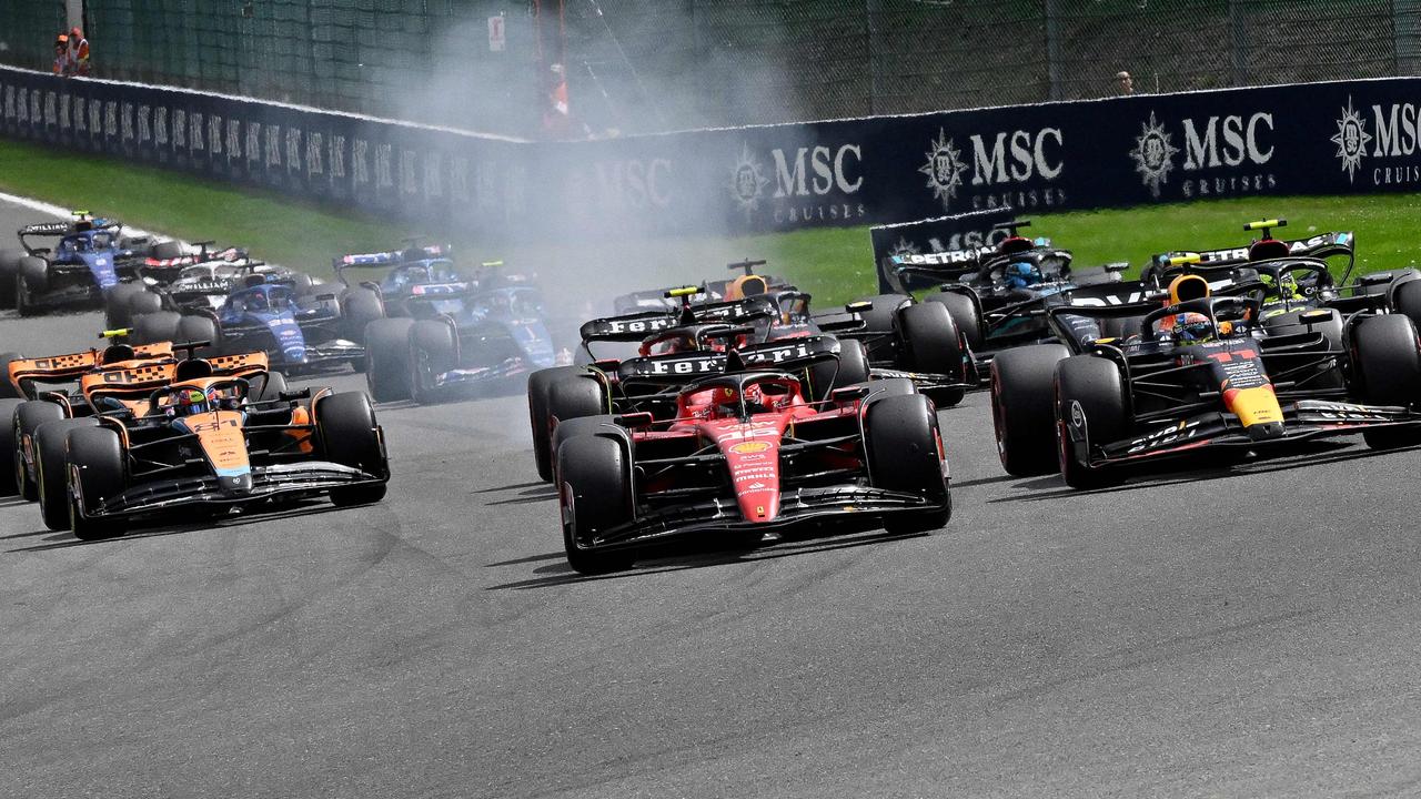 Piastri (left) before Carlos Sainz bumped into him. (Photo by JOHN THYS / AFP)