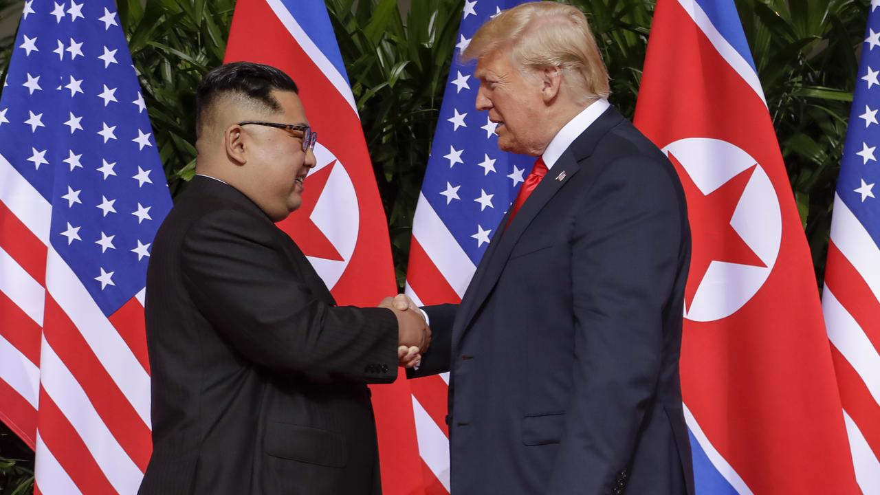 North Korean leader Kim Jong-un and US President Donald Trump shake hands on June 12, 2018 at their historic meeting in Singapore. Picture: AP