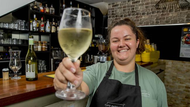 Staff member Toni Woods with a glass of wine at Cafe Radcliffe in Paradise Point. Picture: Jerad Williams.