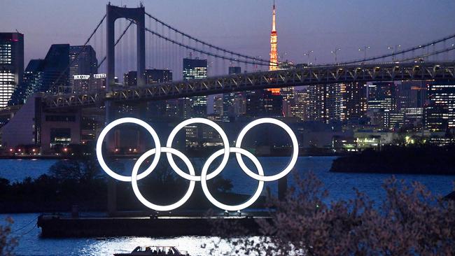 TOKYO, JAPAN - MARCH 25: A boat sails past the Tokyo 2020 Olympic Rings on March 25, 2020 in Tokyo, Japan. Following yesterdays announcement that the Tokyo 2020 Olympics will be postponed to 2021 because of the ongoing Covid-19 coronavirus pandemic, IOC officials have said they hope to confirm a new Olympics date as soon as possible. (Photo by Carl Court/Getty Images) *** BESTPIX ***