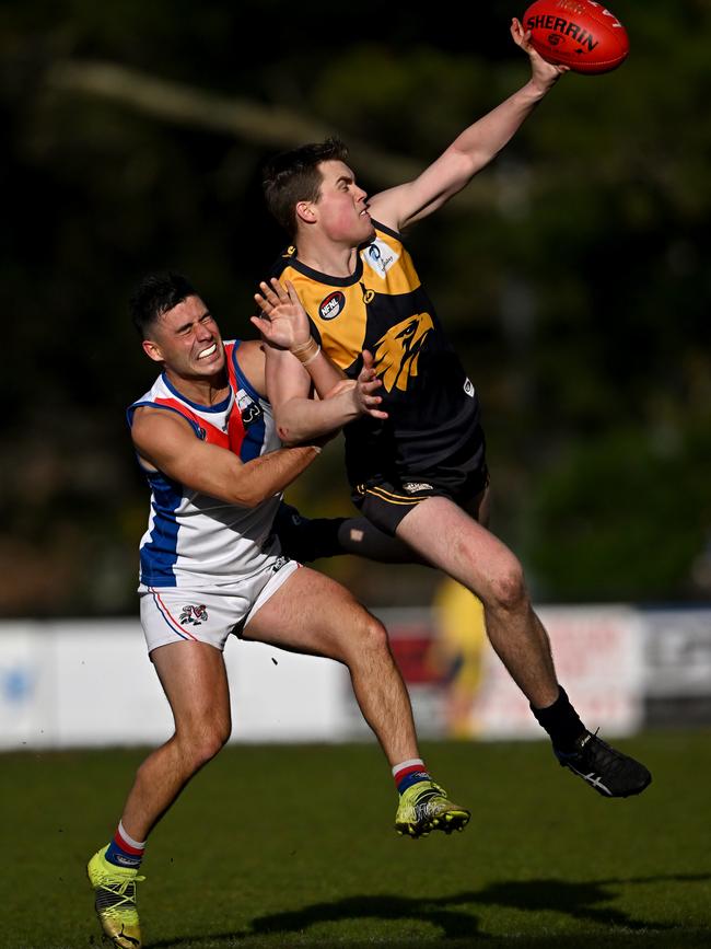 NFL: Whittlesea’s Sam Indian in front of West Preston-Lakeside’s Adam Valeri. Picture: Andy Brownbill