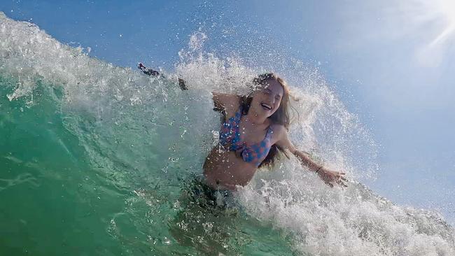 Smiles in the surf. Picture: Jacqui Garnsworthy