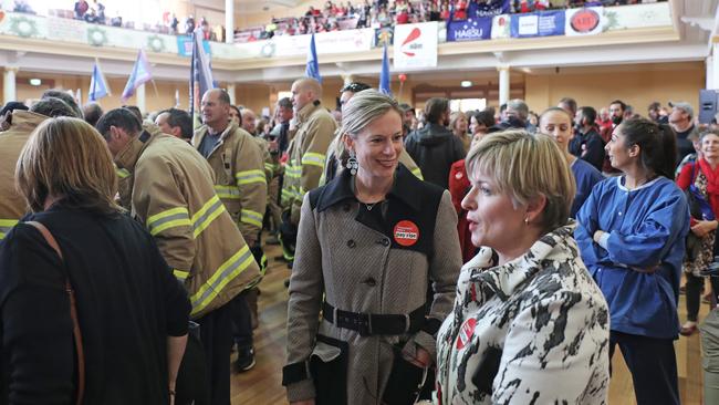 Labor leader Rebecca White, centre, and Labor MP Alison Standen at the rally at Hobart’s City Hall. Picture: LUKE BOWDEN