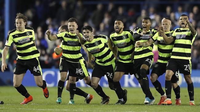 The joy of the Huddersfield Town players as they win a chance to playoff for promotion to the English Premier League. Picture: AP