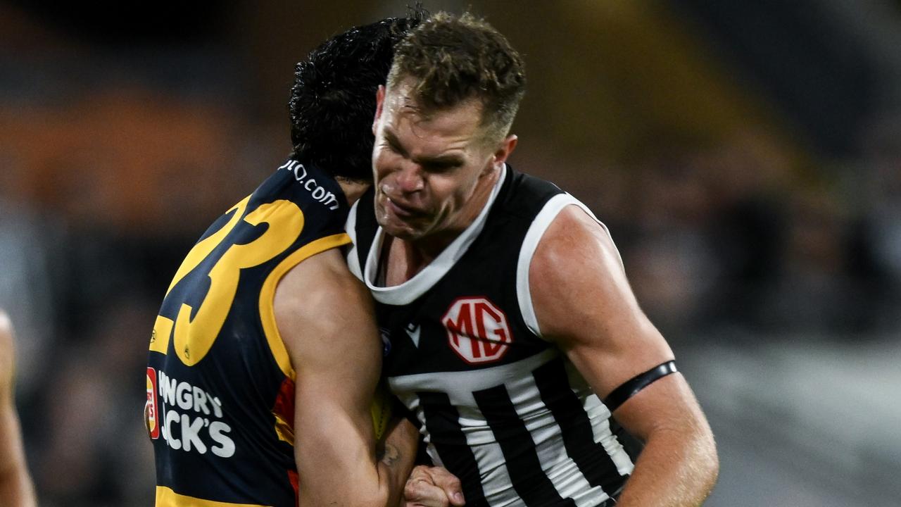 ADELAIDE, AUSTRALIA – AUGUST 17: Izak Rankine of the Crows is knocked out by a late hit from Dan Houston of the Power during the round 23 AFL match between Port Adelaide Power and Adelaide Crows at Adelaide Oval, on August 17, 2024, in Adelaide, Australia. (Photo by Mark Brake/Getty Images)