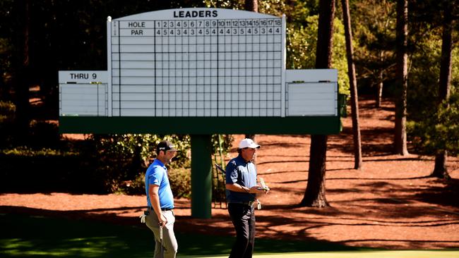 Spain’s Jon Rahm American Phil Mickelson wait on the 10th hole during a practice round prior to the start of the 2017 Masters Tournament at Augusta National Golf Club.