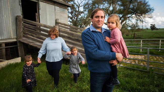 Jonathan Dyer with his wife Tiarnee and their children (L-R) Beatrix, 3, Tallulah, 5 and Mabel, 2. The Dyer family have a farm in Kaniva, western Victoria. Picture: Paul Jeffers/The Australian