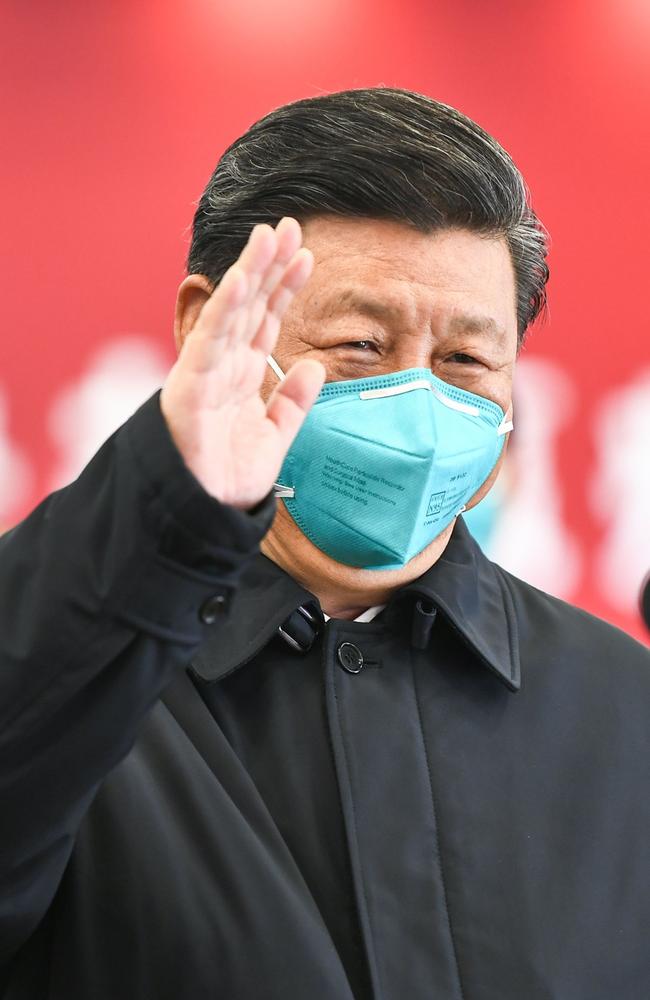 President Xi Jinping waves to a coronavirus patient and medical staff via a video link at the Huoshenshan hospital in Wuhan on March 10. Picture: Xie Huanchi/XINHUA/AFP