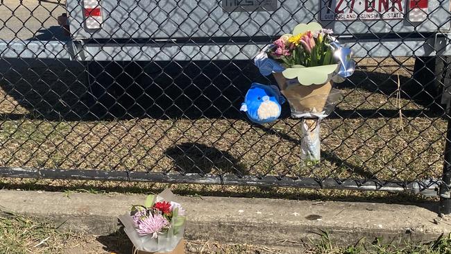 Flowers and toys have been left at a memorial space at Gate 8 of the Rockhampton Showgrounds in tribute to a three-year-old boy who tragically died after being hit by a car. Photo: Geordi Offord