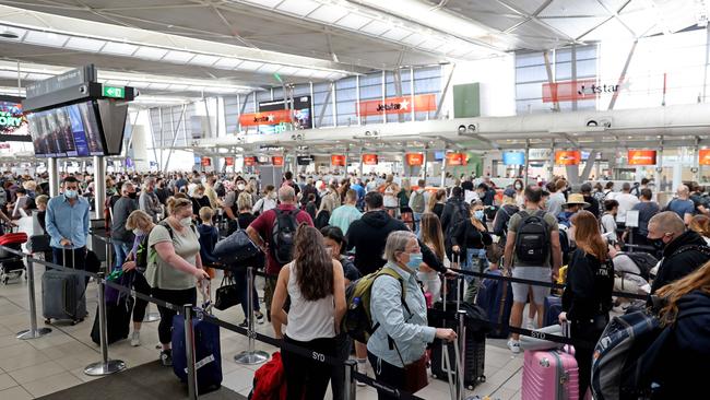 Frustrated travellers were left queuing for hours in lines that snaked around the foyer and outside. Picture: NCA NewsWire/Damian Shaw