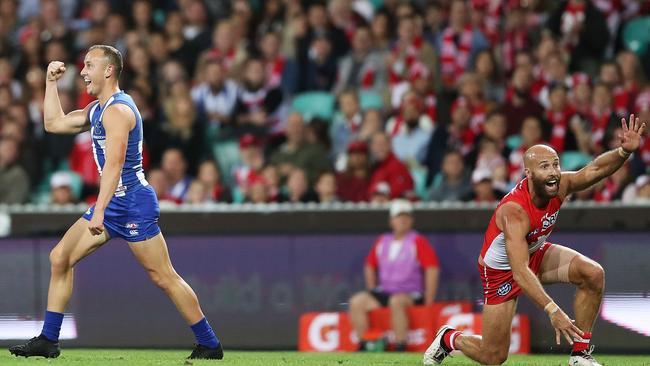 Jarrad McVeigh appeals that he touched the ball as Hartung celebrates. Picture: Getty Images