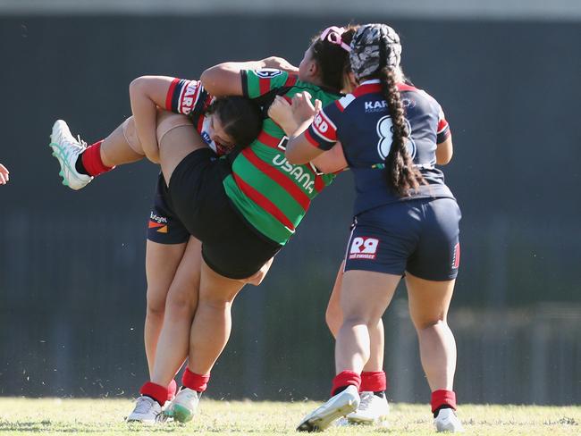 Crushing defence from the Roosters. Picture: Sue Graham