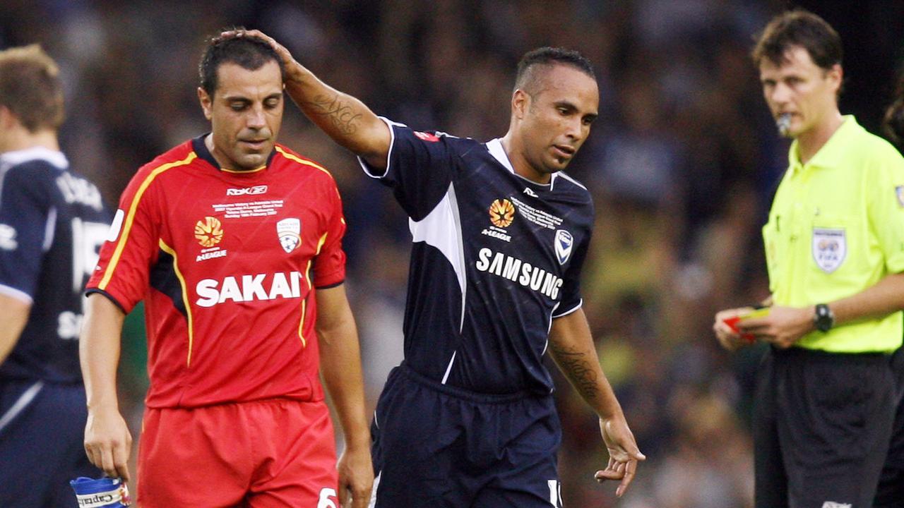 Adelaide United’s Ross Aloisi gets a pat on the head from Melbourne Victory’s Archie Thompson after being sent off in the 2007 A-League grand final.
