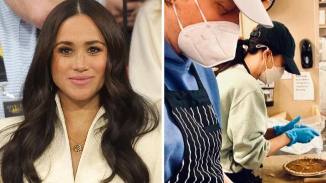 Meghan Markle helps to prepare a Thanksgiving meal for homeless women while a photographer captures the moment. Picture: Archewell