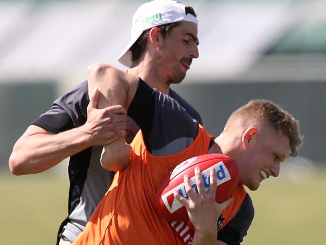 Collingwood training Scott Pendlebury tackles Adam Treloar & Daniel Wells Picture:Wayne Ludbey