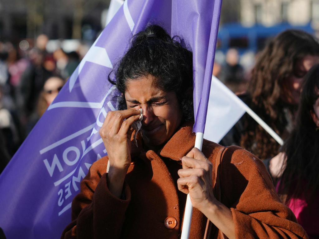 A woman sheds tears as France becomes the only country in the world to clearly protect the right to terminate a pregnancy in its basic law. Picture: Dimitar Dilkoff/ AFP)