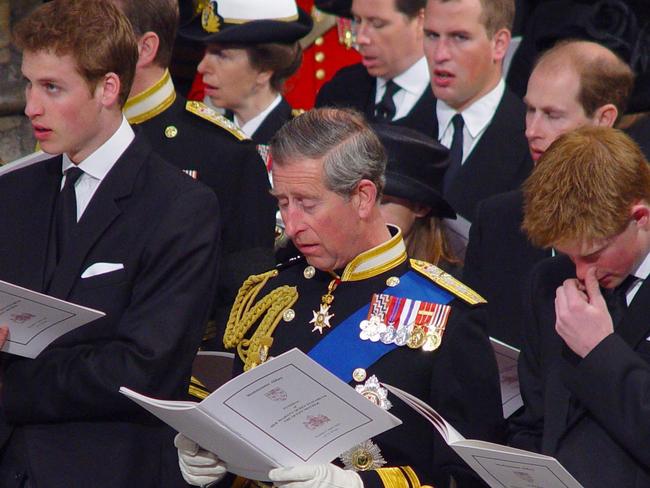 Harry (right) with dad Charles and brother William (left) singing at Westminster Abbey. Picture: Supplied