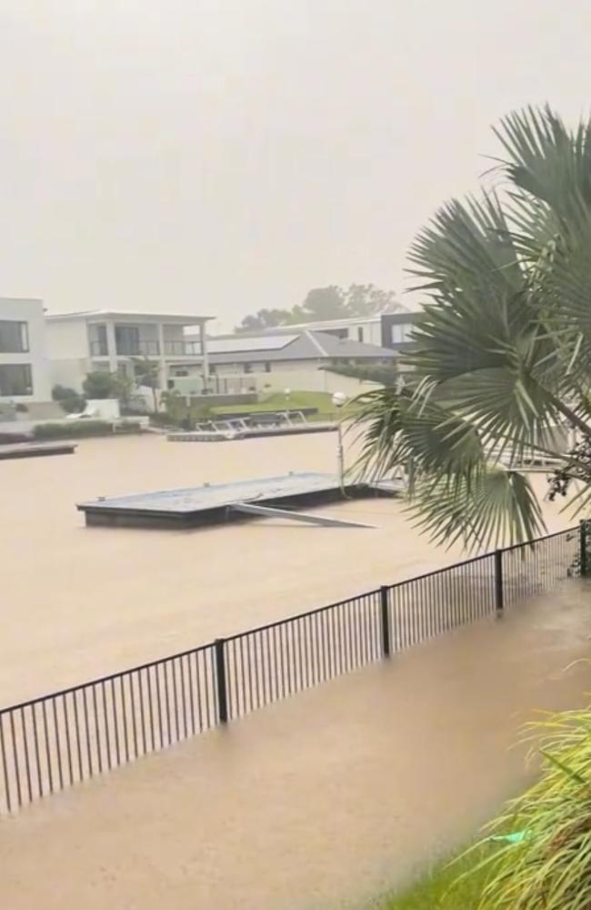 Gold Coasters living by the water woke on Monday to flooded rising water levels, with some finding their properties, jetties and pontoons submerged or swept away after heavy rain drenched the city overnight. Picture: Tiktok/@diaryofsunnysoulsisters