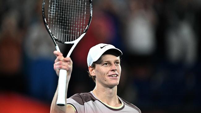 TOPSHOT - Italy's Jannik Sinner celebrates victory against Russia's Andrey Rublev during their men's singles quarter-final match on day 10 of the Australian Open tennis tournament in Melbourne on January 24, 2024. (Photo by Anthony WALLACE / AFP) / -- IMAGE RESTRICTED TO EDITORIAL USE - STRICTLY NO COMMERCIAL USE --