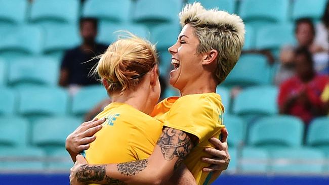 Michelle Heyman (R) and Claire Polkinghorne celebrate against Zimbabwe.